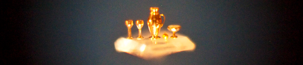 A sculpture by Nikolai Syadristy of 3 cups, a pitcher, and an apple carved out of gold and placed on a single sugar crystal, as seen through a microscope. Wrong kind of minimalist. A sculpture by Nikolai Syadristy of 3 cups, a pitcher, and an apple carved out of gold and placed on a single sugar crystal, as seen through a microscope. Wrong kind of minimalist.